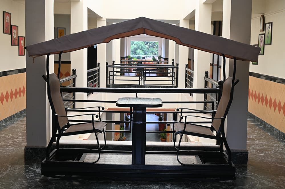 A canopied swing in the hotel corridor overlooking the atrium